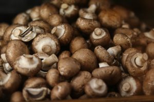 A pile of fresh brown mushrooms